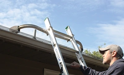 A ladder stabilizer will hold you steady. 