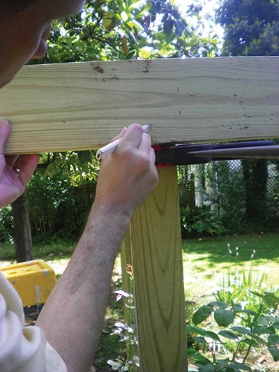 Mark corresponding bolt holes on both the posts and the 2x6 band.