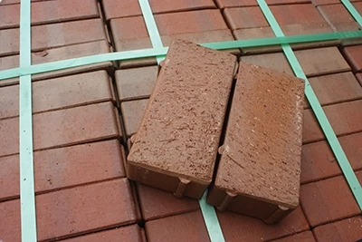 For patios, clay pavers are more durable than face bricks, able to withstand up to 13,000 lbs. per square-inch of pressure. 