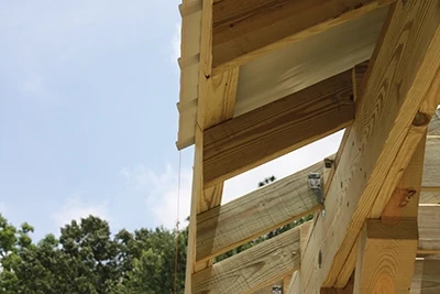 To help gauge the overhang, attach a layout string parallel to the eave as a guide. 