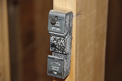 Align the IsoMax in a level layout along the wall and screw them to the face of the studs. 
