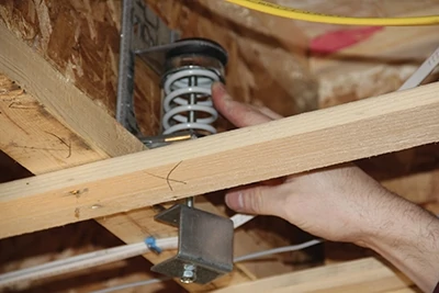 When mounted on the joists, you can position the ceiling hanger to optimize ceiling height. 