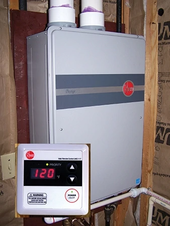 Tankless water heaters only warm the water as it is needed, eliminating the need for the system to continually cycle on to maintain a heated tank. Some units include a remote control with digital display. 