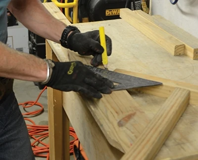 Cut a 45-deg. miter on the end of a brace. Set the top and back in a T. Place the brace where you like it on the back. Run your layout square across the brace and get the top parallel with the square's blade. Mark the brace. That's your cut. 