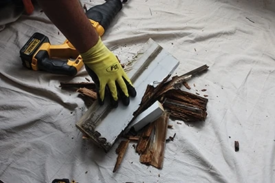 Remove and dispose of all rotted wood, including casing and/or brick molding. 