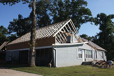 The extra height gained from the new roof allows room for a gable window vent on the front of the home. 