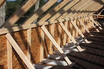 This knee-wall was constructed to raise the eave of the new roof and give the home a taller, grander design. 