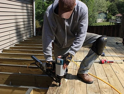 If a deck board is bowed, install it with a crown on top. Gravity combined with the weight of people and furniture will flatten the board and prevent sagging. 