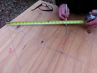 Carefully align your pencil with the tape measure to trace the line. 