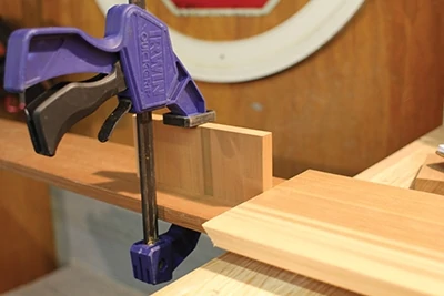 For repetitive production cutting, set stop blocks for the workpieces on your miter saw. 