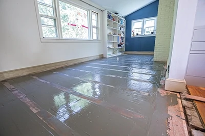 When the leveling compound has cured, install the hardwood flooring according to standard procedures. 