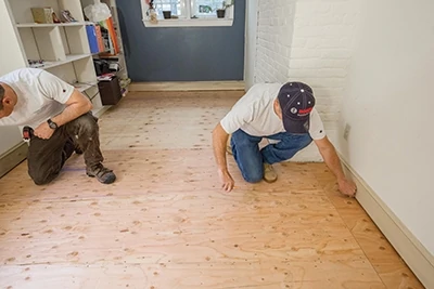 Plan the installation as you would any standard flooring job by snapping lines to guide board placement and accounting for out-of-square walls. 