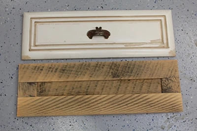 Shown here is a replacement for a drawer front, which exhibits the rough sawn texture the home-owner desired. 