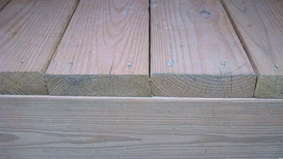 The rule of thumb for installing deck boards: Put the best side up. 
