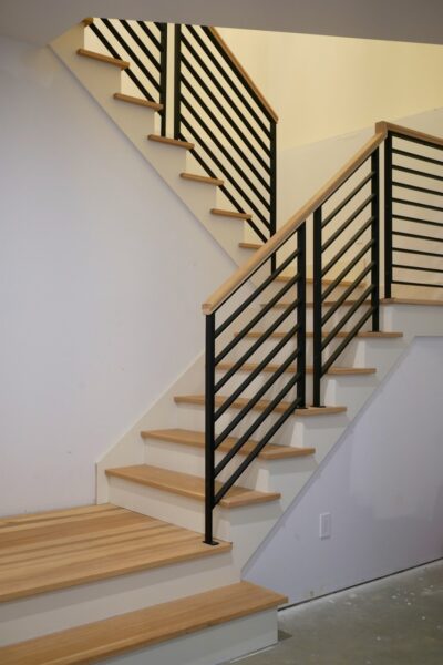 Basement Stairway Combines Wood and Metal for Appealing Transitional ...