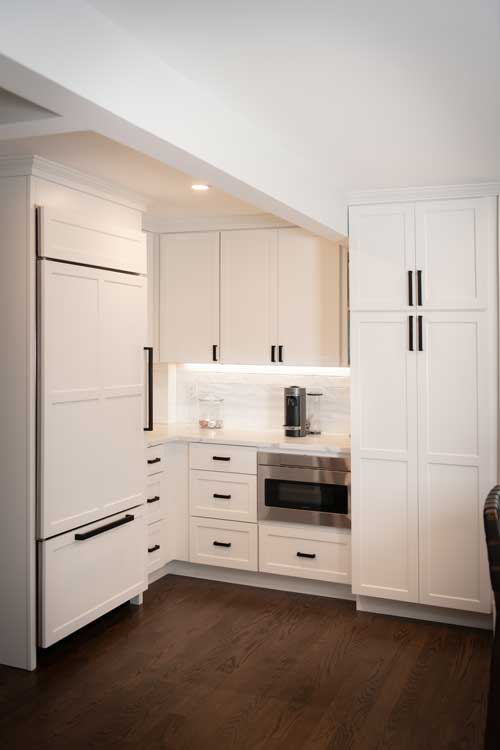 White Shaker stock cabinets that look custom