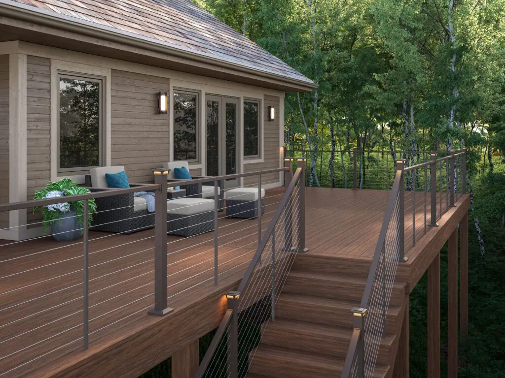 Voyage Decking featuring Surestone™ technology in Mesa coupled with Contemporary Cable Railing in Brown