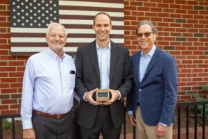 Trex CEO Adam Zambanini (C) with company founders Roger Wittenberg (L) and Andrew Ferrari (R)