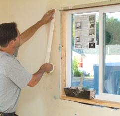 apply joint tape to the drywall over the first layer of compound