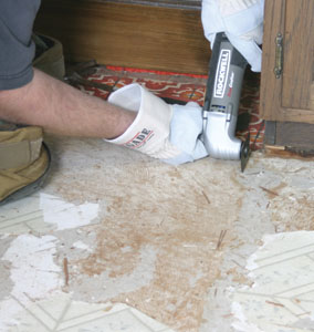 The Rockwell multi-purpose vibrating tool was used to cut through the vinyl and 1/4" plywood subfloor around the edges of the kitchen cabinets.