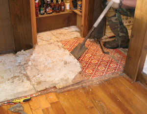 Then, a roofer's tear-off tool made quick work of removing the old flooring.