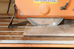 Cutting notches is fast with a bridge-type tile saw.