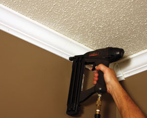 Nail the moulding into the studs.