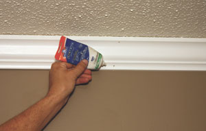 Finish by caulking, filling nail holes, finish-sanding and adding touch-up paint. 