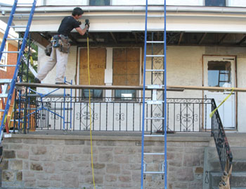 Sometimes, simply gaining access to porch parts can be the challenge. You need to get up there without touching the work. In this case, I split apart two Werner extension ladders, giving me a total of four ladders. By adding brackets, I was able to use a walk-board.