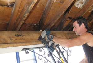 Every porch I've done is different and is a personal space. In this case, some old boards found in the house were recycled as trim elements for the interior fascia. 