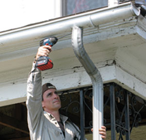 Half-round gutters are not only a nice touch on an old house, but they work better than ogee profiled gutters. Get them from a roofing supply house.