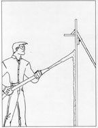 A diagram of a man applying shotcrete in layers to the concrete fence