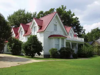 A house with a painted aluminum metal roof