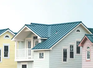 Several houses next to each other with a various types of metal roofs